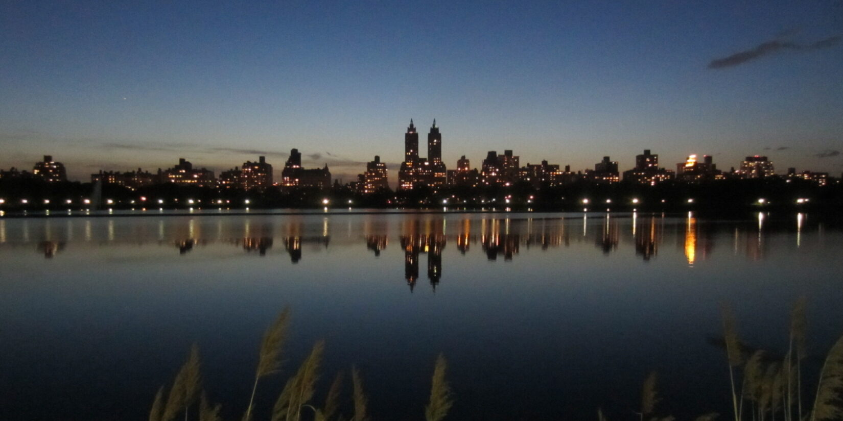 The skyline reflected on the water of the Reservoir, at dusk