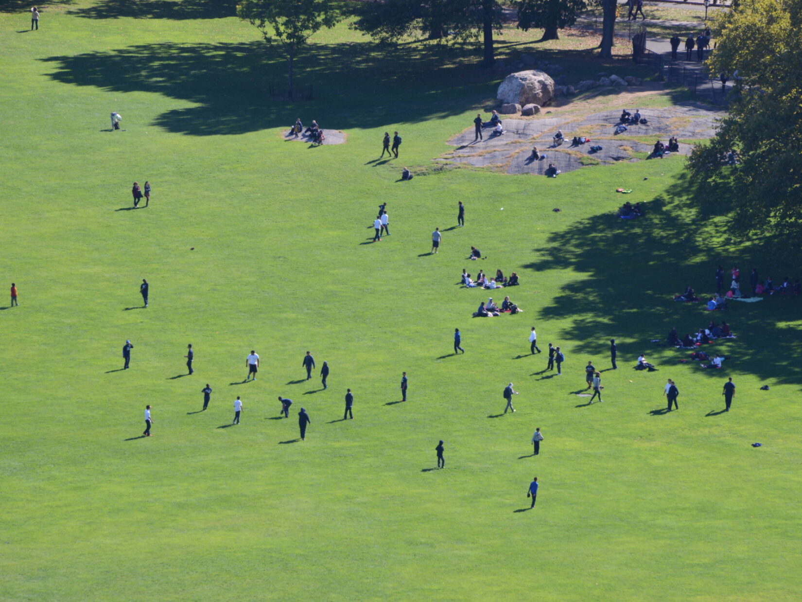 An aerial view of the Sheep Meadow showing people playing football