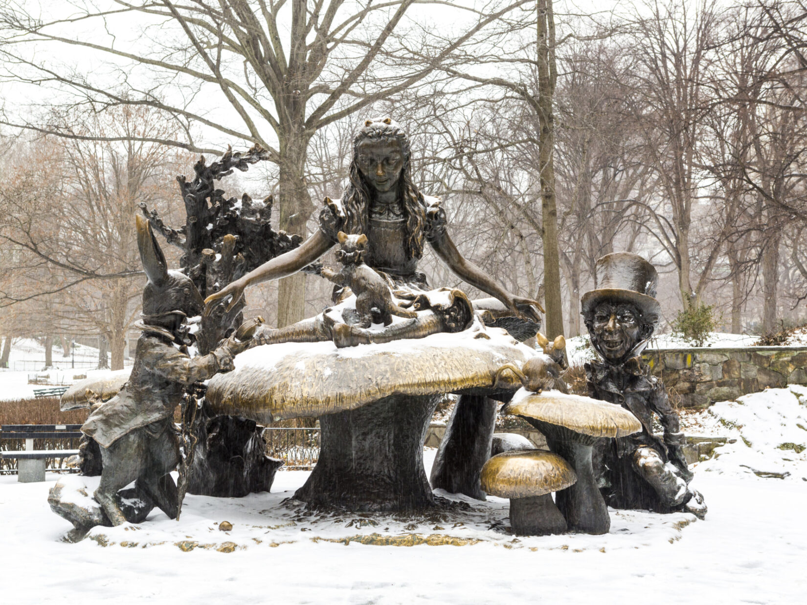 The Alice in Wonderland statue, depicted with winter snow