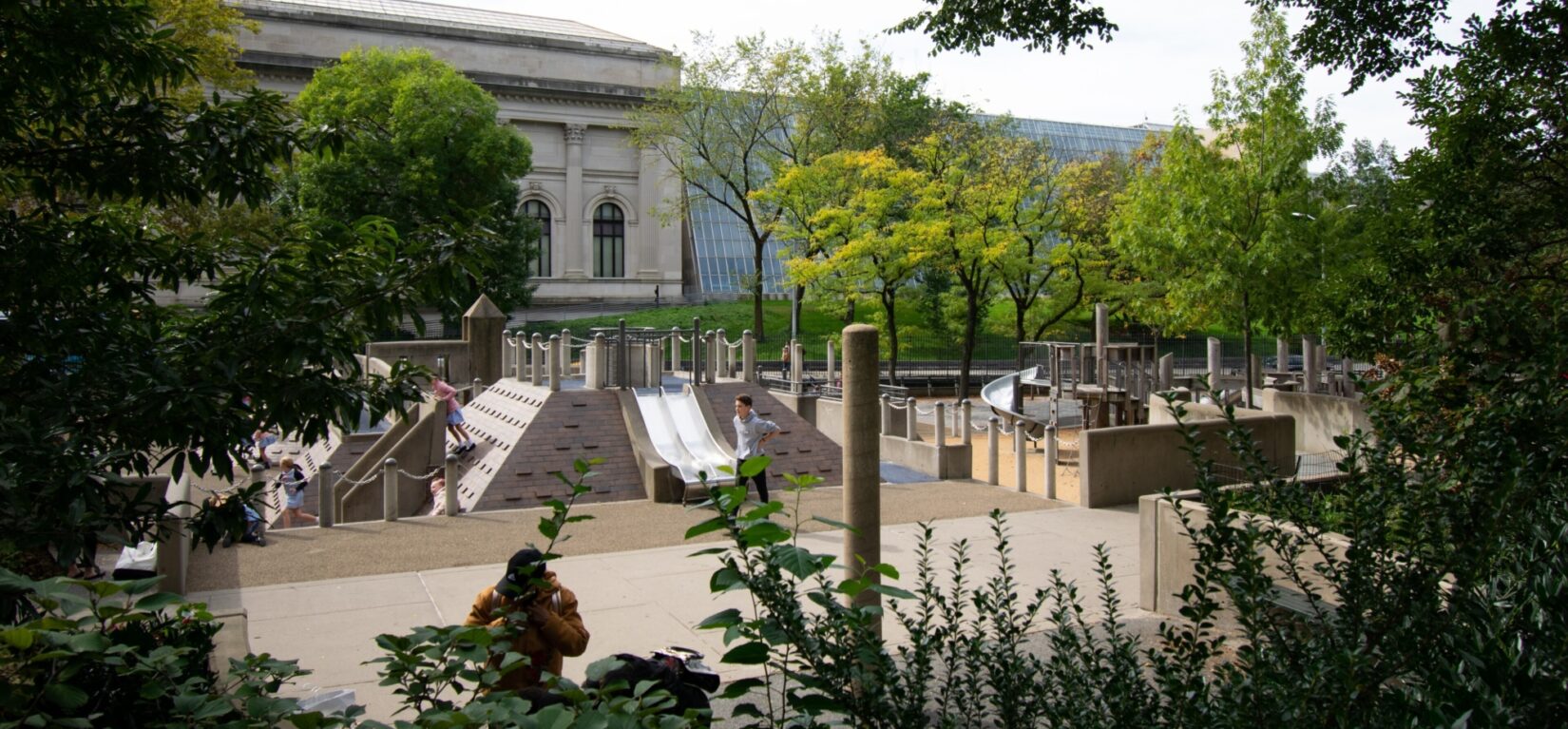 The playground seen through shaded trees