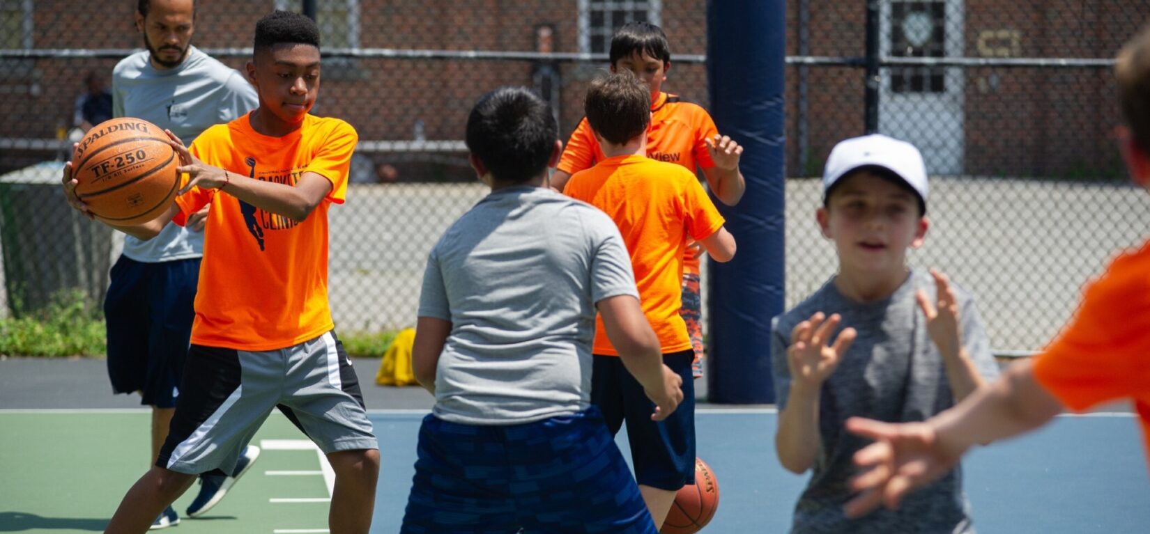 Kids in a spirited basketball game at the clinic