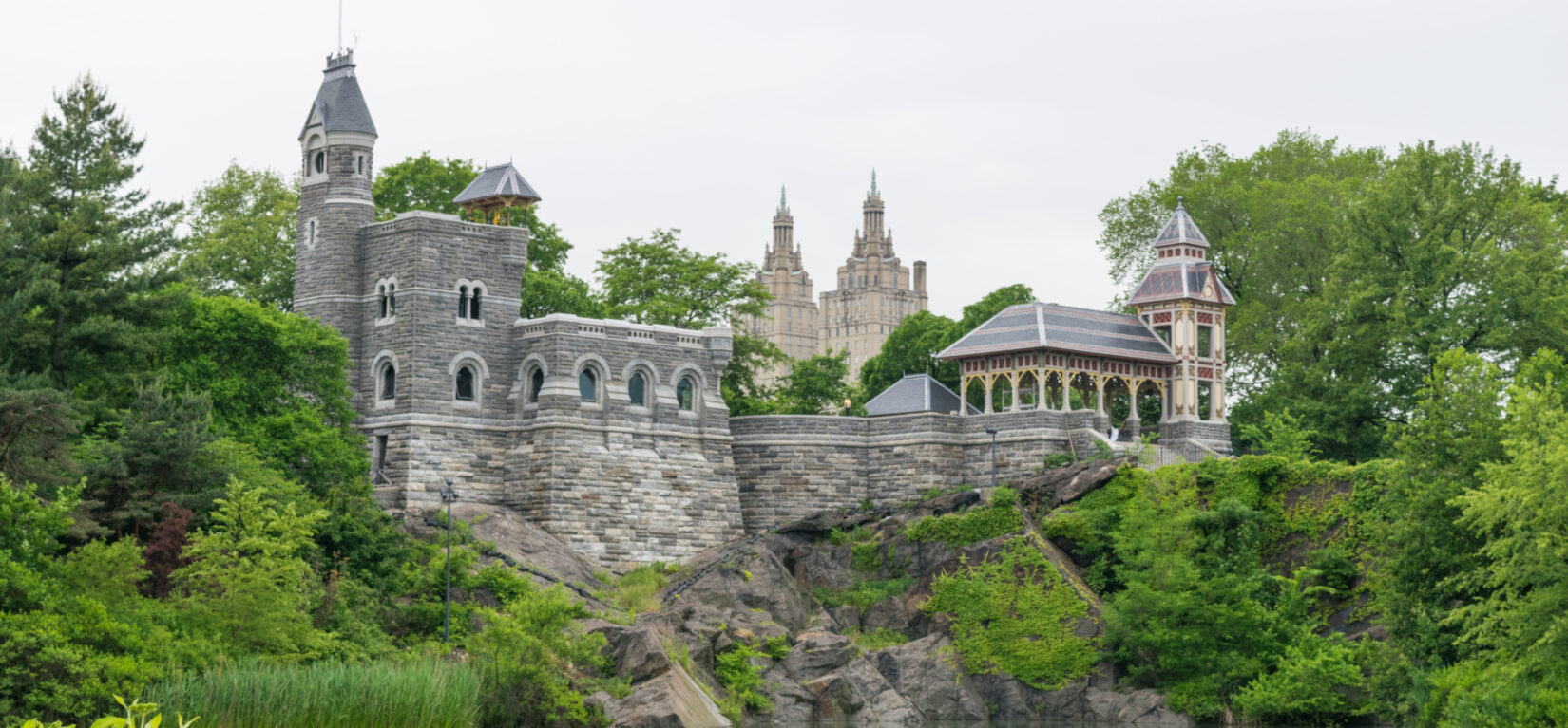 The castle looms over Turtle Pond on a summer day