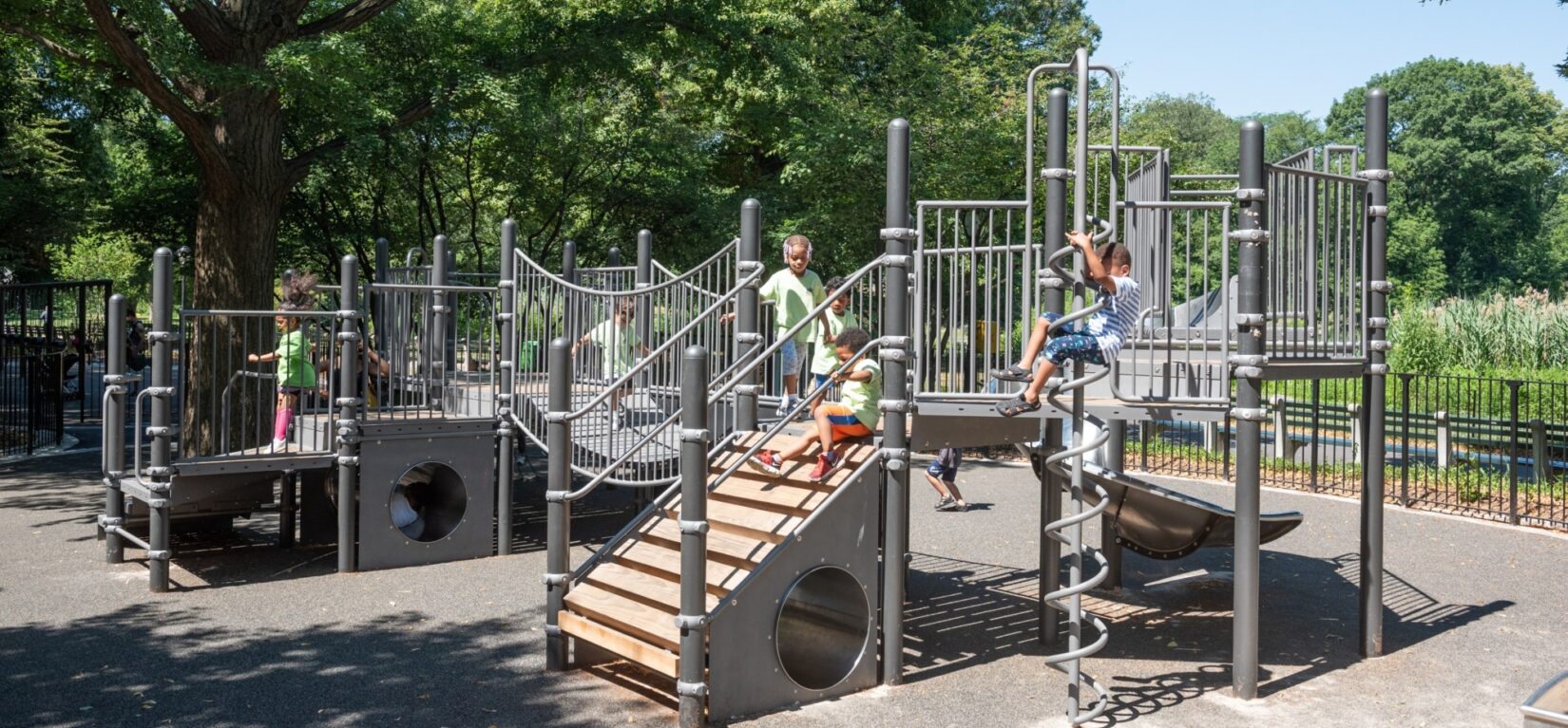 Small children enjoy the play structures in the playground