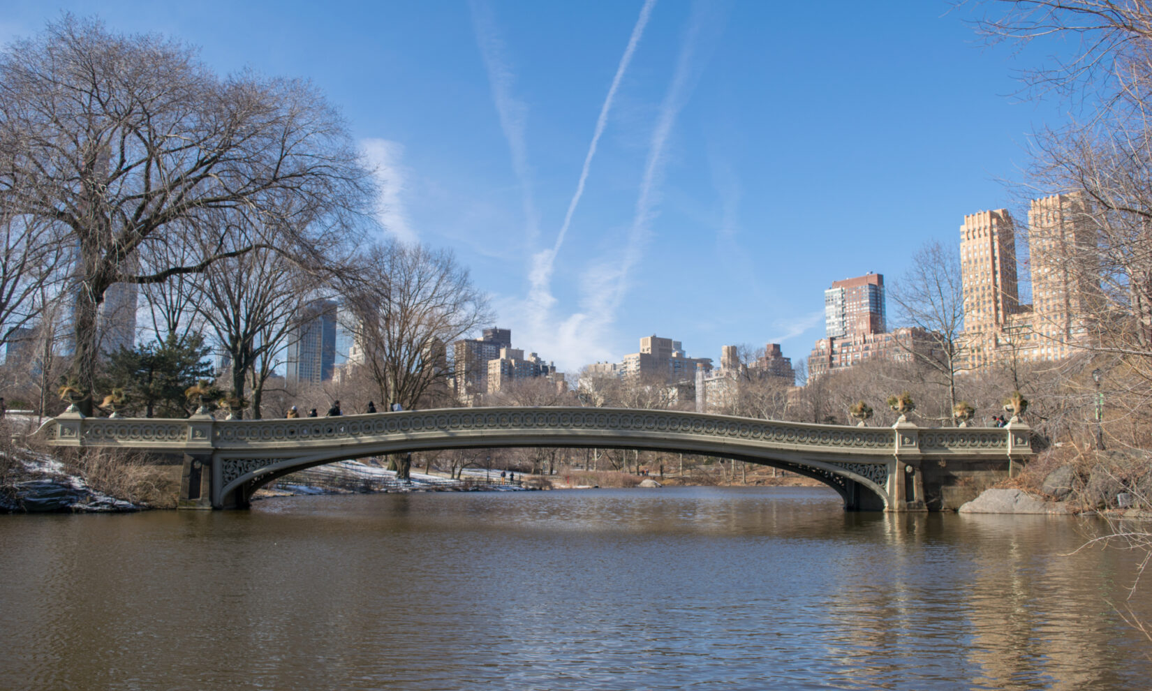 The bridge spans the Lake under a crisp, blue winter sky.