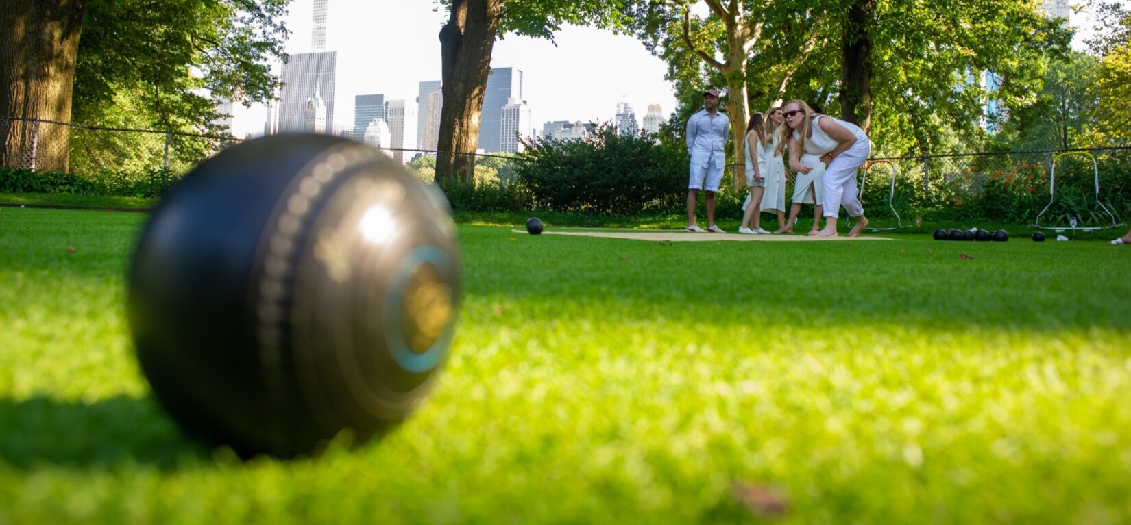 Lawn bowlers practicing their craft in summer