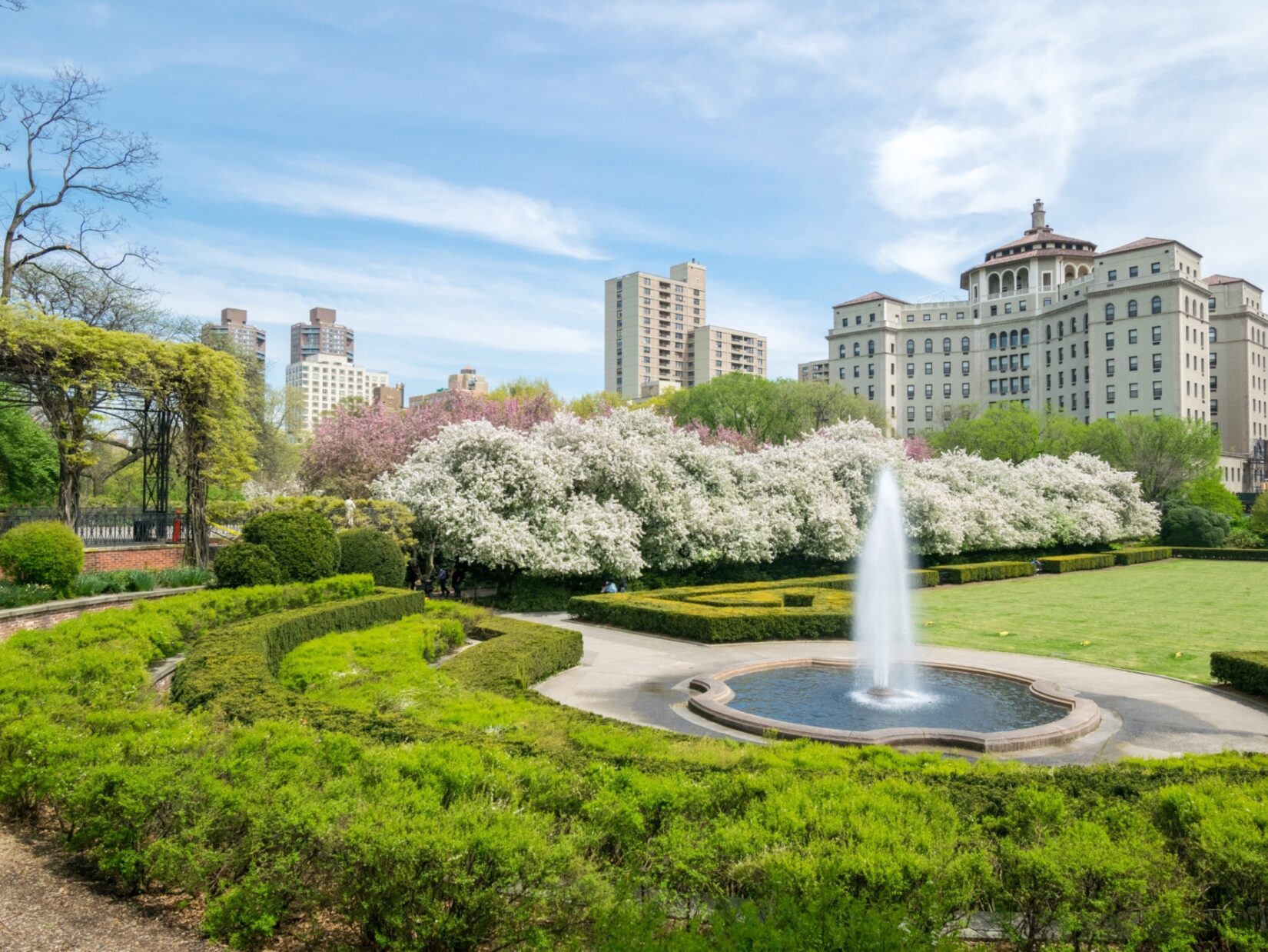 A view of Conservatory Garden featuring the fountain and a section of the pergola