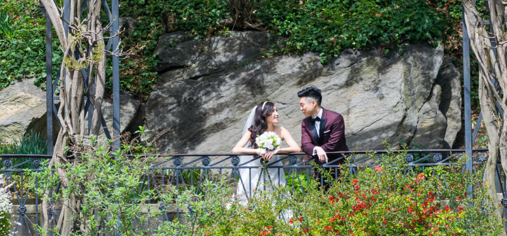 A bridge and groom in a casual moment in Conservatory Garden