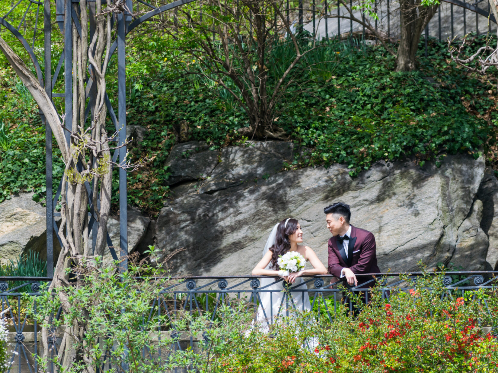 A bridge and groom in a casual moment in Conservatory Garden