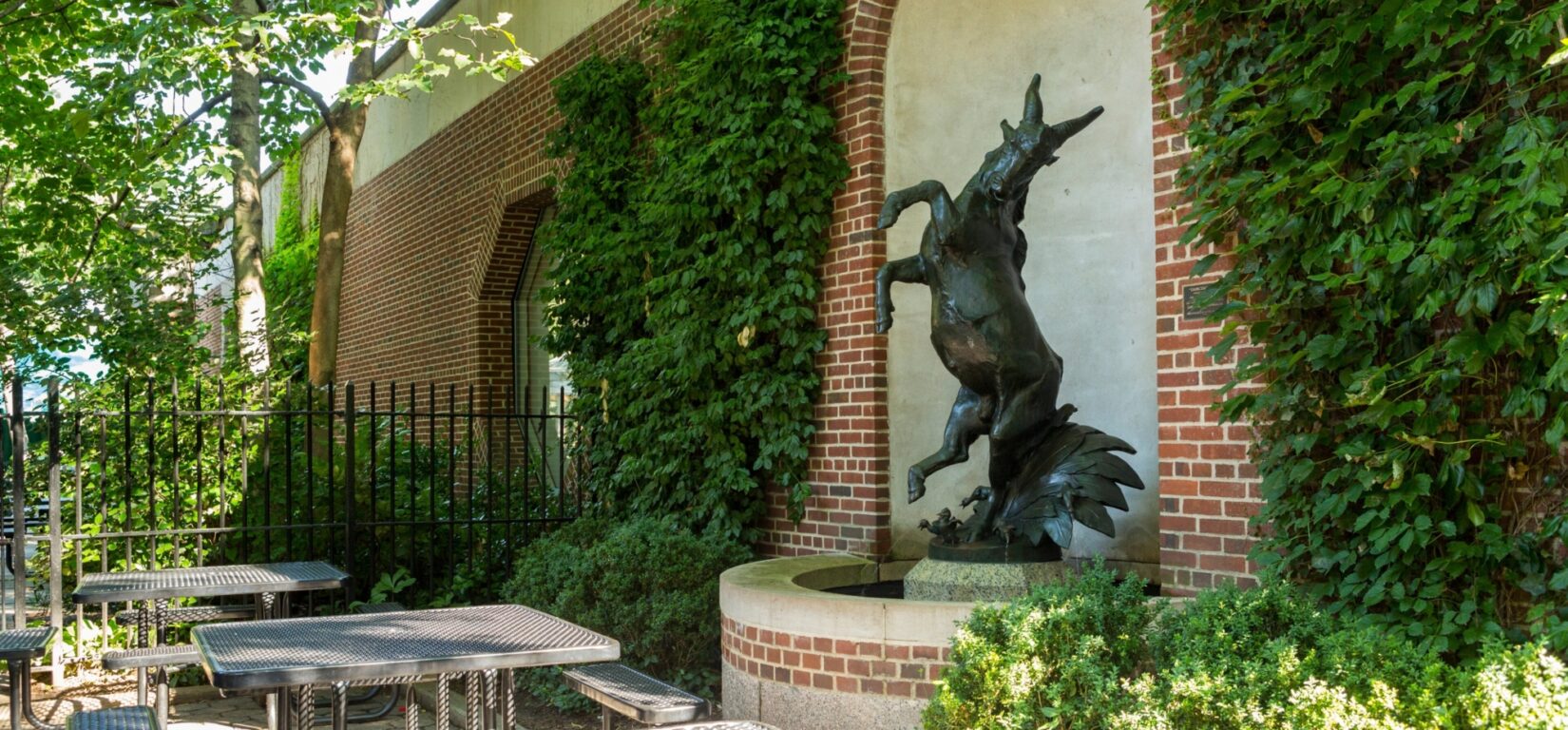 The statue in a niche at the Central Park Zoo