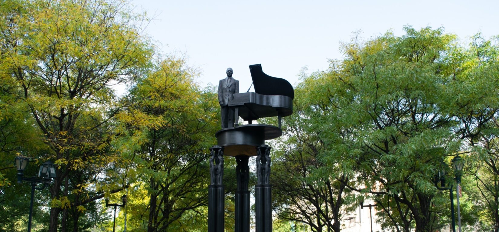 The tall pedastals supporting the sculpture hold Duke Ellington high in the air