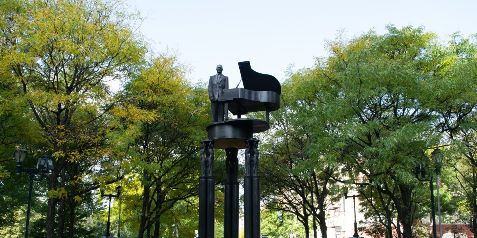 The tall pedastals supporting the sculpture hold Duke Ellington high in the air