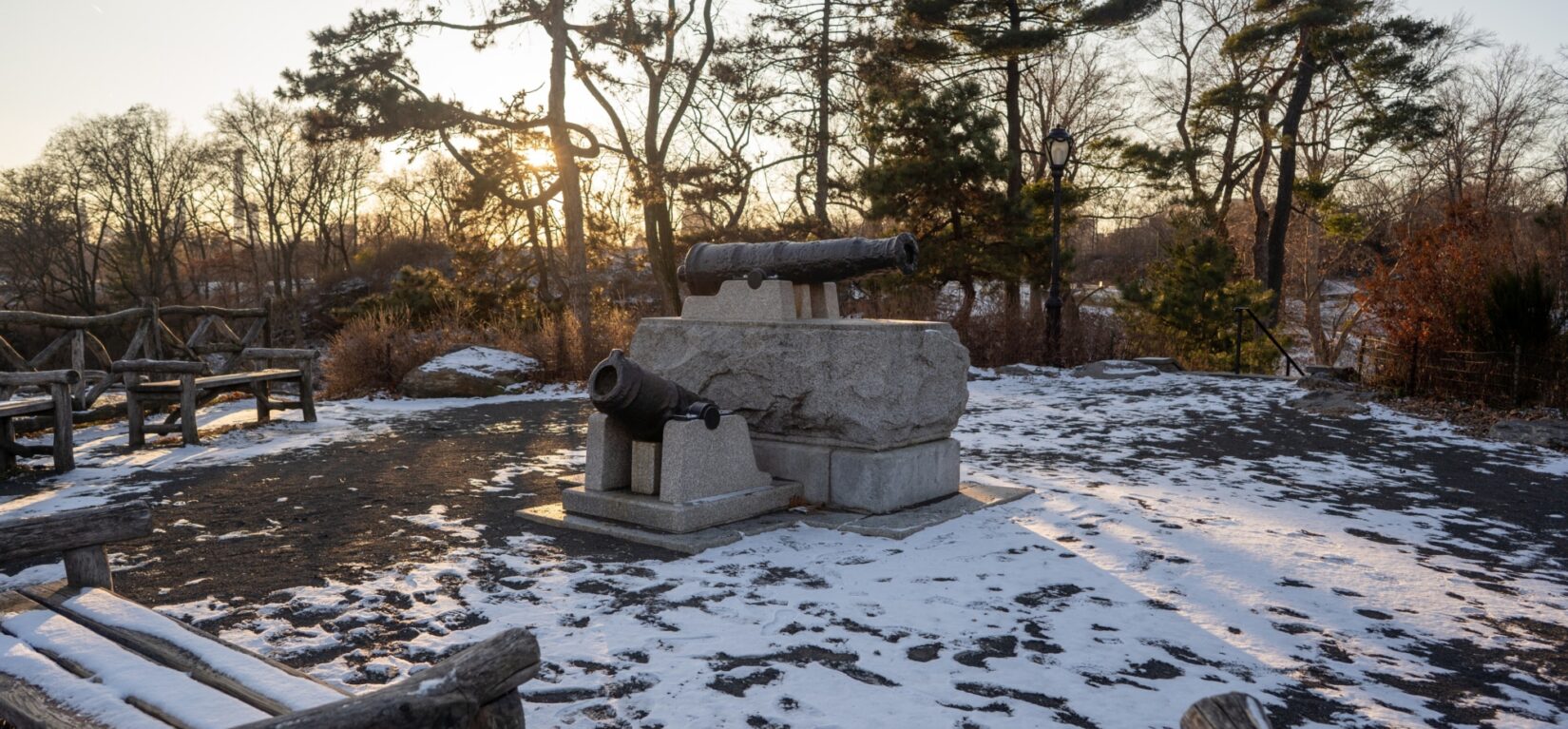 A view of Fort Clinton in winter, featuring a cannon and mortar