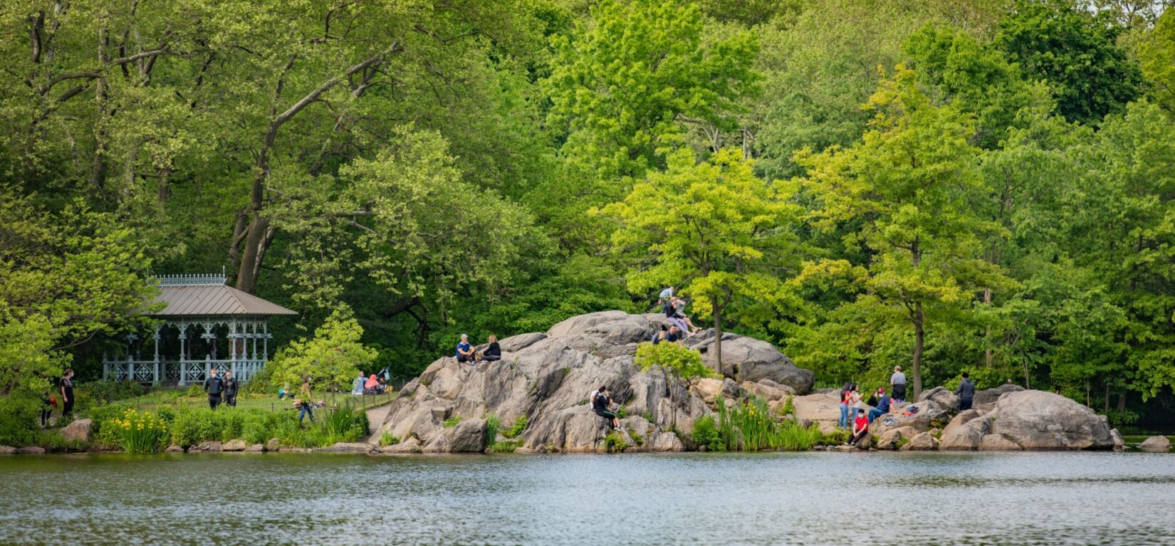 Visitors enjoy the view of the Lake from the rocks of Hernshead