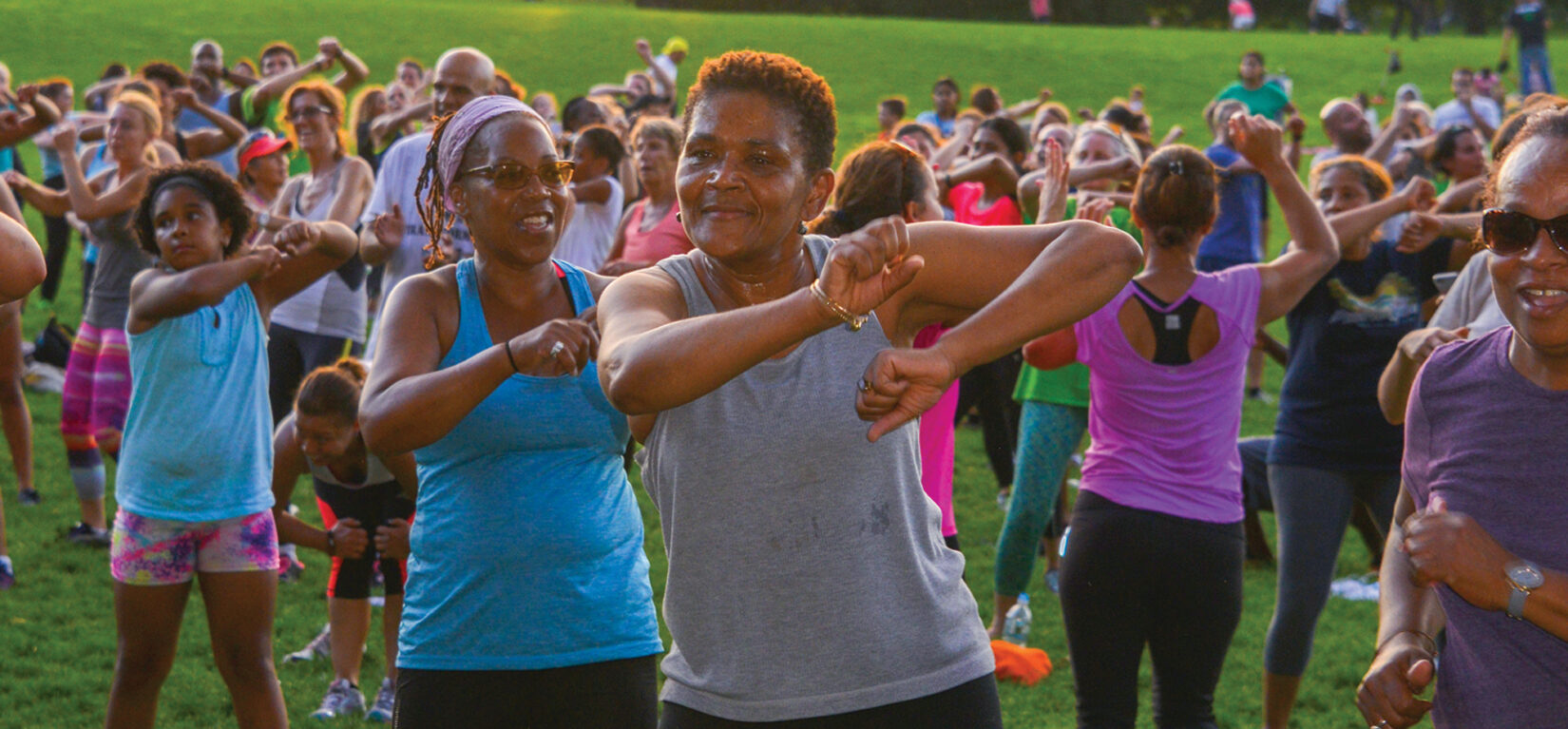 A group of people doing a fitness class in Central Park