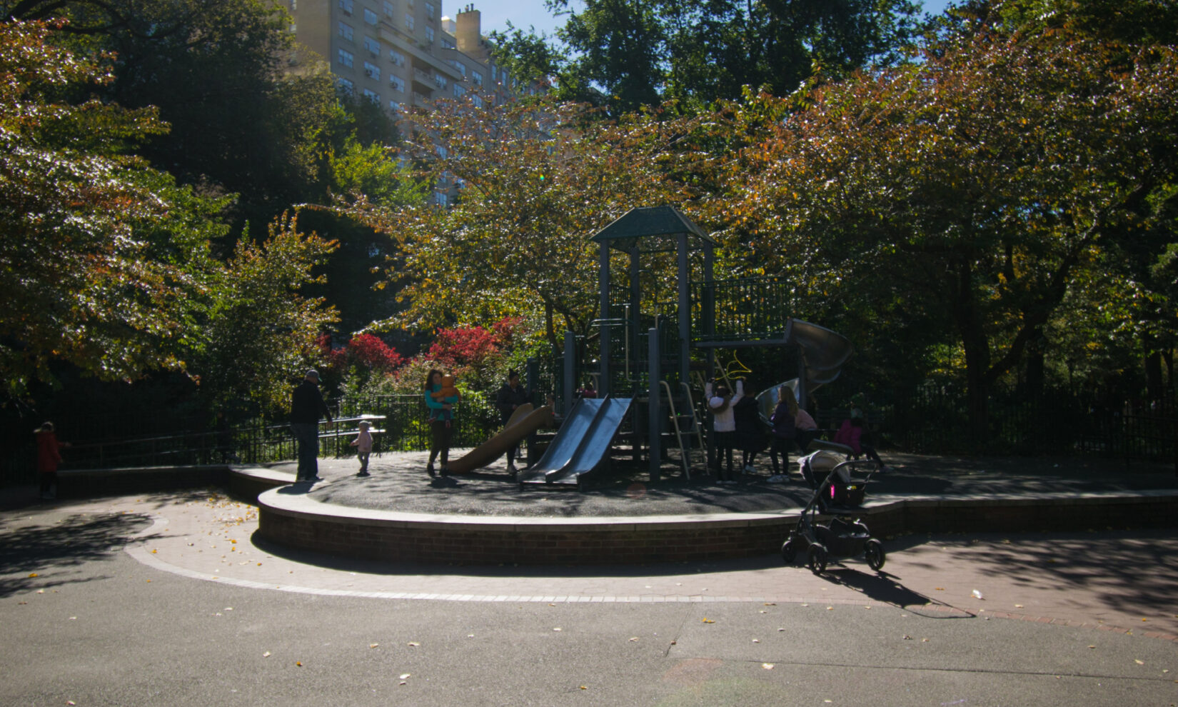 Late afternoon light shadows the playground