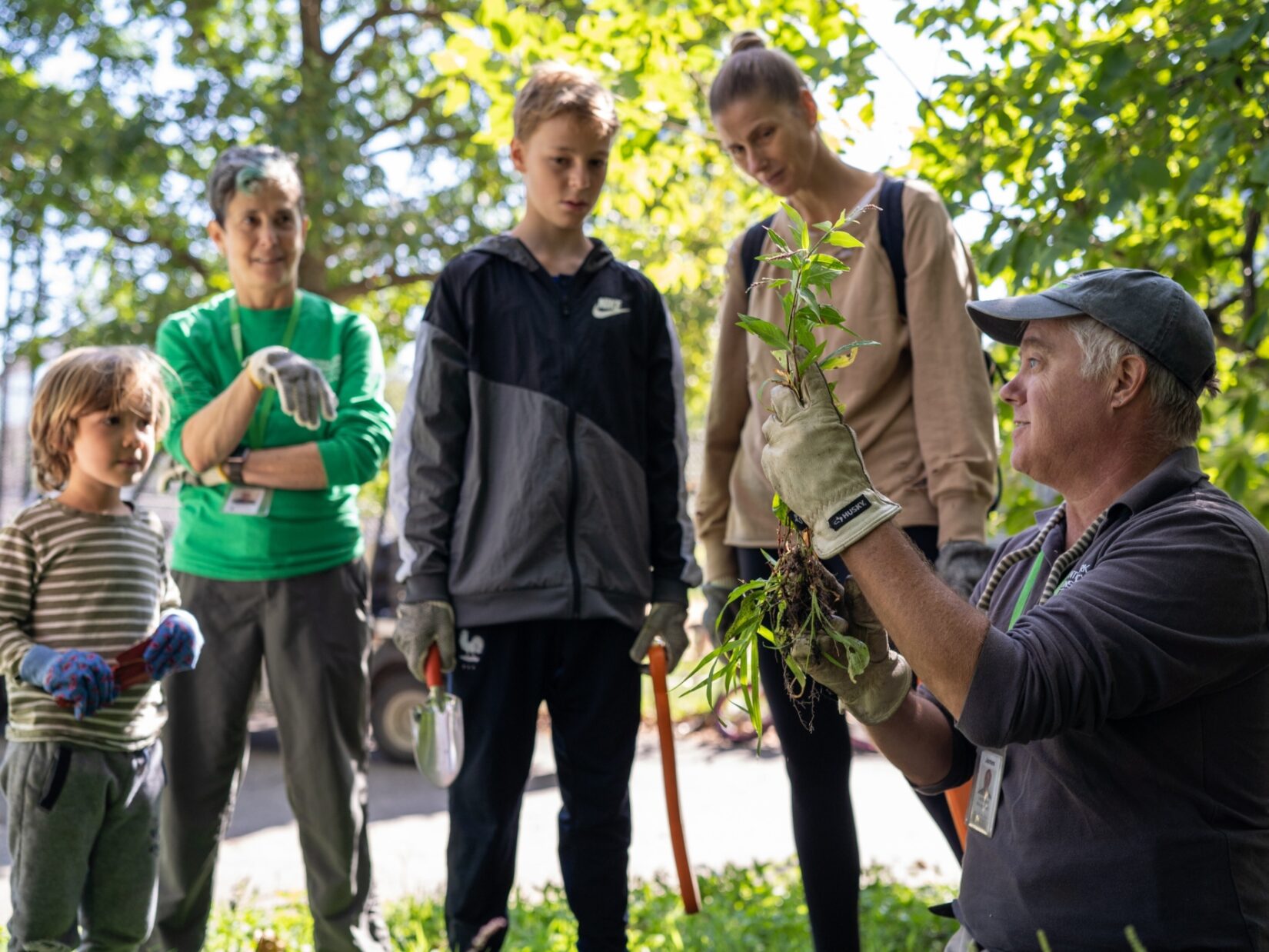 A family taking in instructions from a CPC staff member