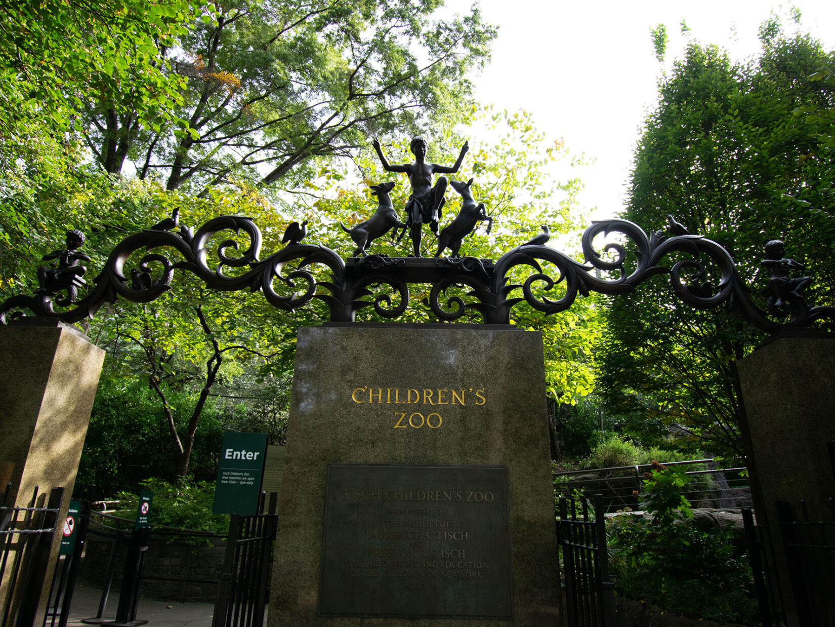 Looking up at the Lehman Gates, highlighting the detail of the ironwork