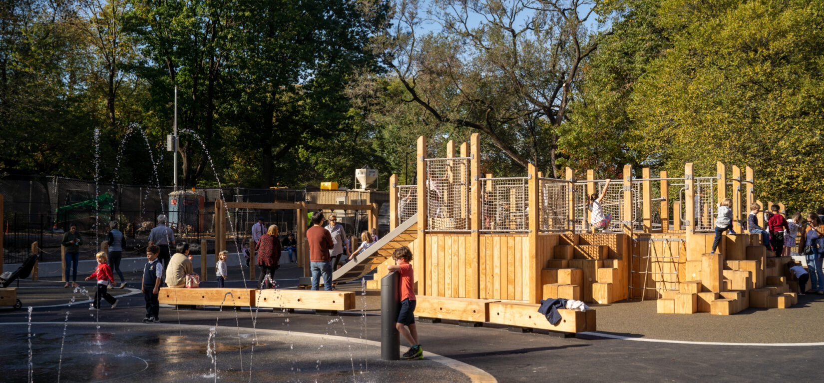 Children enjoying the Kempner Playground's wooden apparatus