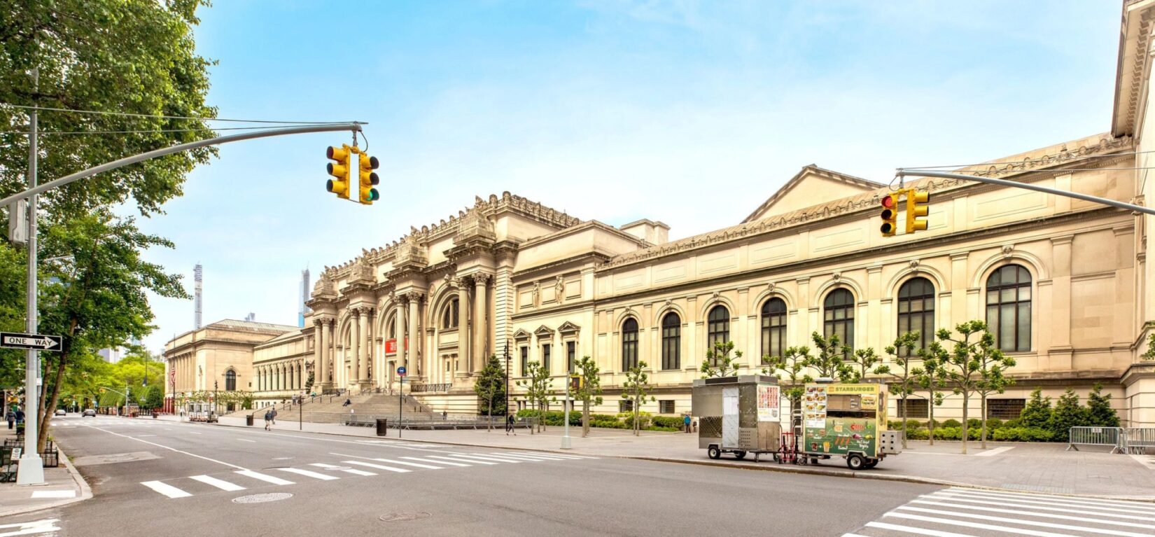 A wide-angle shot of the blocks-long facade of the Museum, seen from across Fifth Avenue.