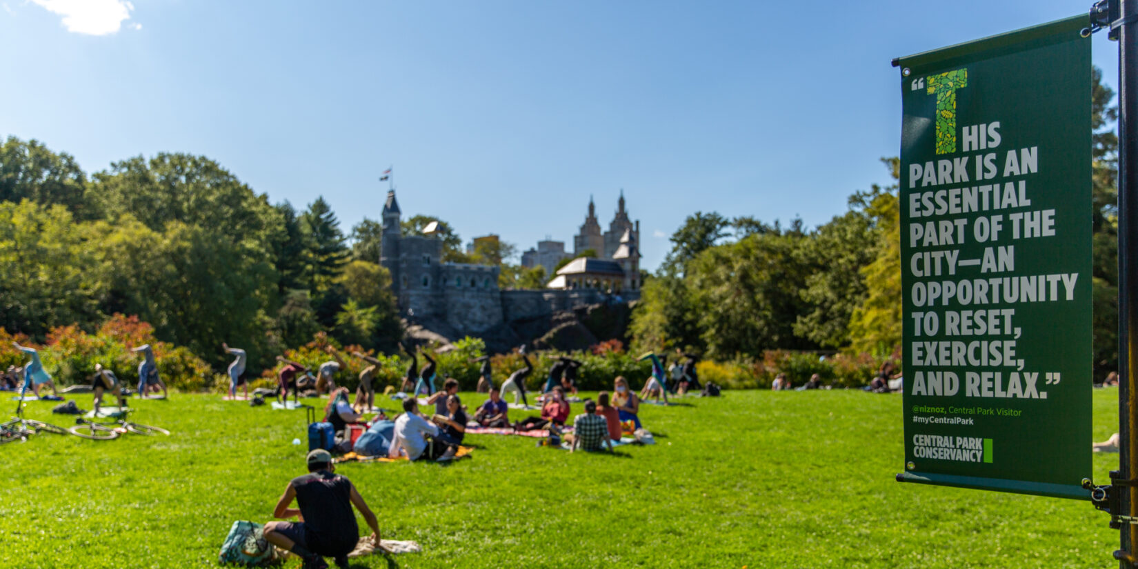 An example of the banners highlight this photo of parkgoers lounging on a lawn.