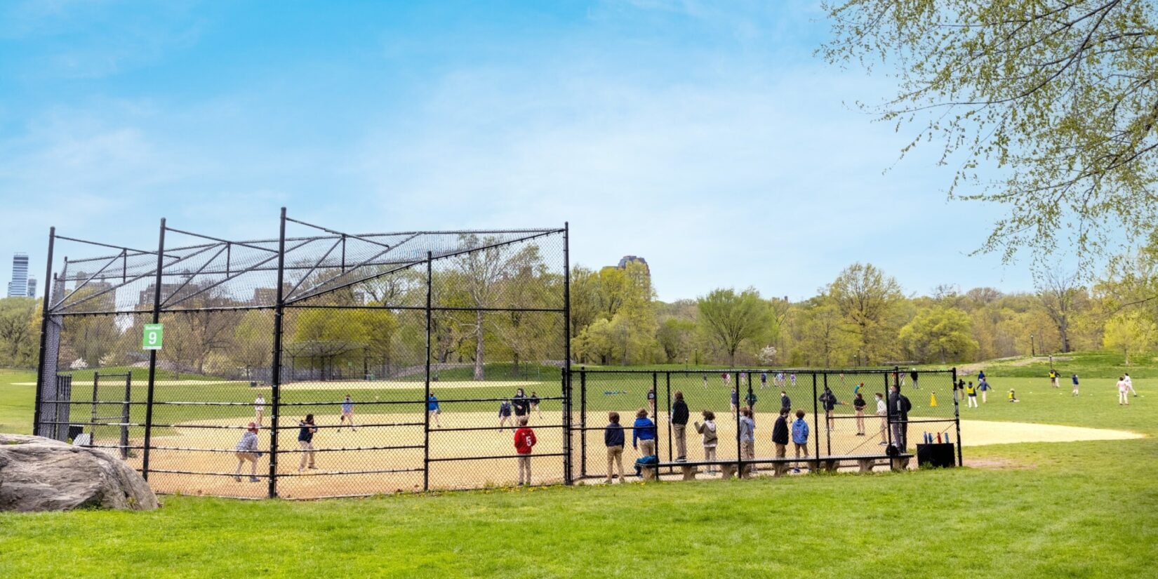 Ballplayers in early spring pictured in mid-inning