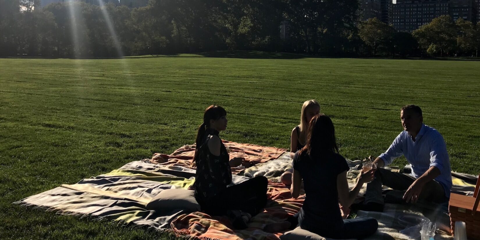 Phil Rosenthal and ballet dancers having a picnic on the Great Lawn