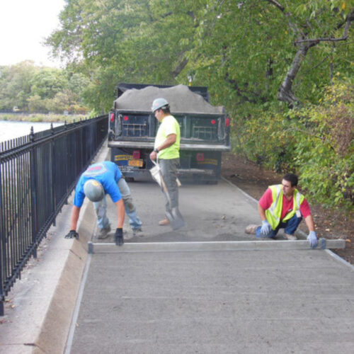 Workers leveling the running track