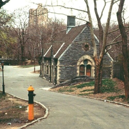 The Dairy in 1980 on a gray winter day, surrounded by bare trees and a paved road.