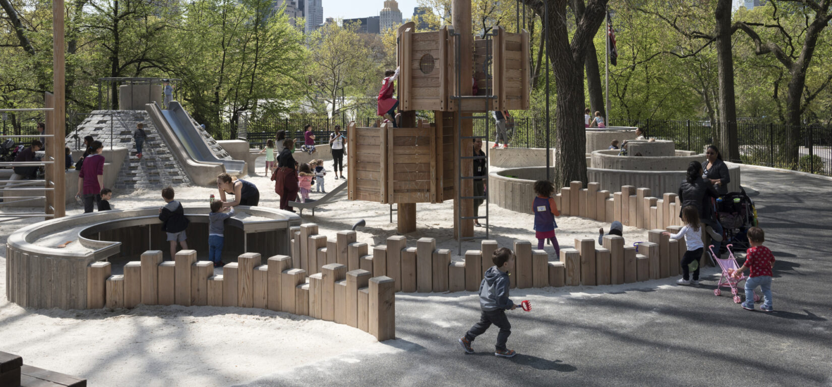 Small children playing on a crisp spring day in Adventure Playground