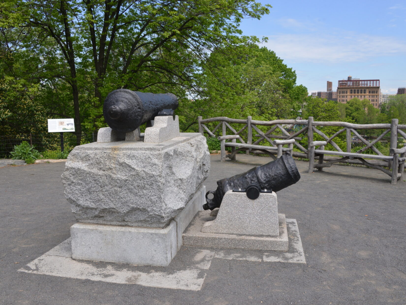 Two antique canons on rough-hewn stone foundations commemorate the Fort Clinton landscape.