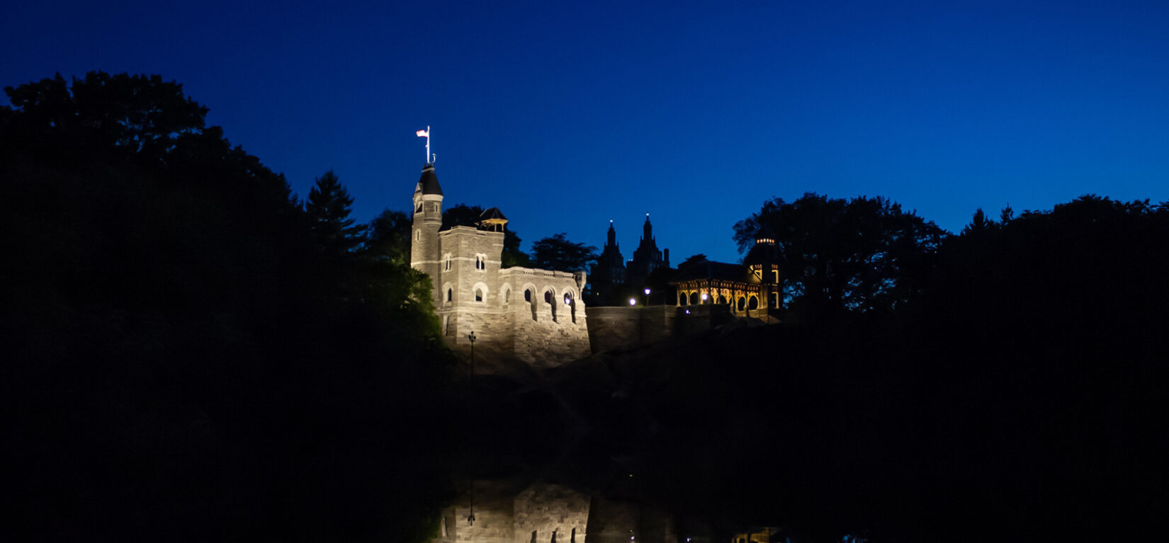 The Castle seen from across Turtle Pond, lit dramatically at night