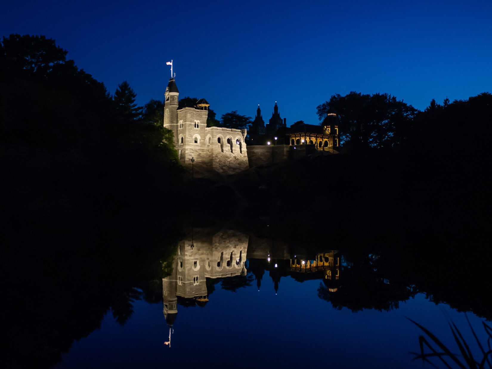 The Castle seen from across Turtle Pond, lit dramatically at night