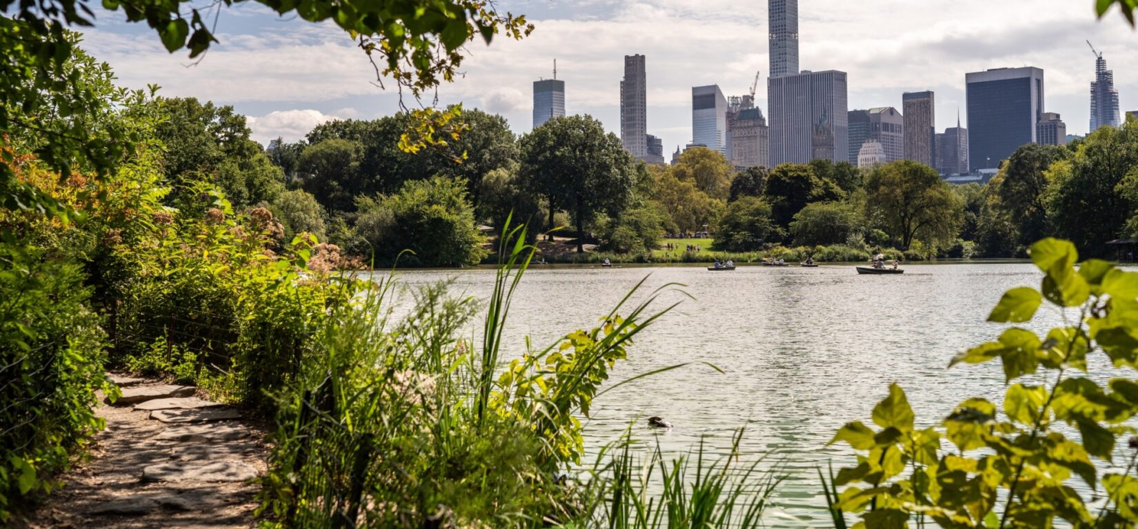 A view looking across the lake toward the skyline of Manhattan's East Side