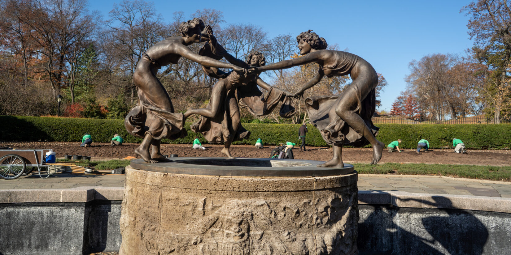 With the Untermeyer Fountain in the foreground, Park volunteers are seen working the flowerbeds.