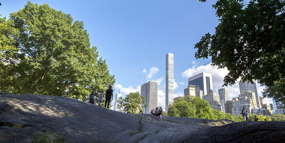 A view looking up to Umpire Rock with the skyline on the horizon