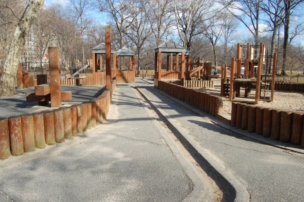 A shallow concrete trench is a feature of the playground before reconstruction