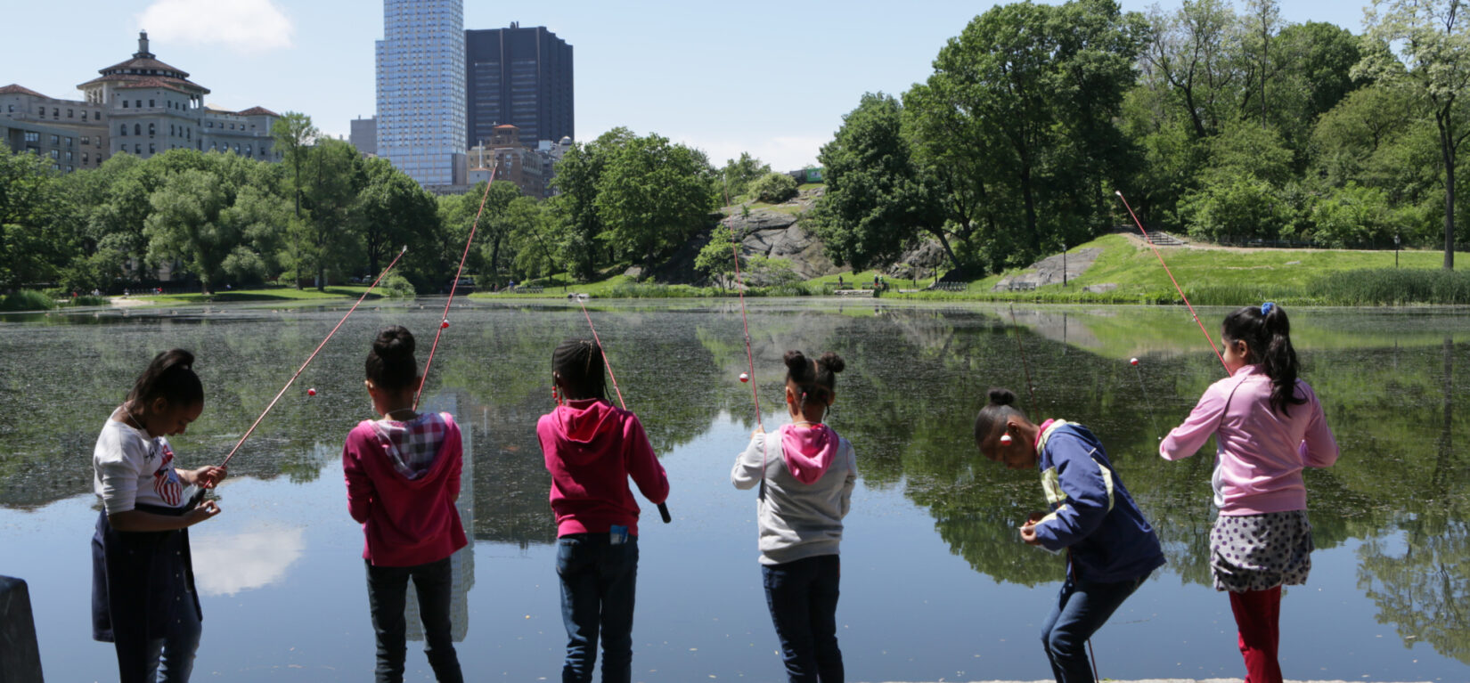 Kids fishing along the Harlem Meer